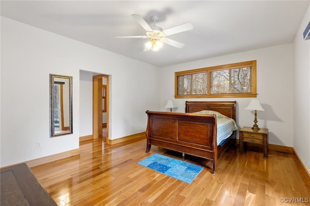 bedroom featuring hardwood / wood-style flooring and ceiling fan