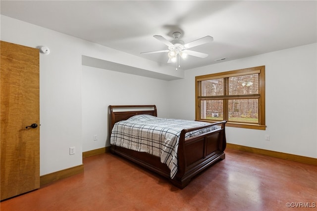 bedroom with ceiling fan and concrete floors