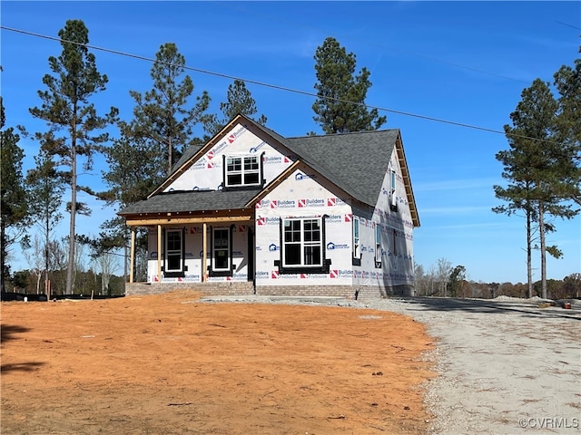 property under construction featuring covered porch