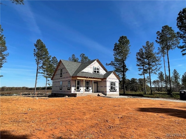 unfinished property with a porch