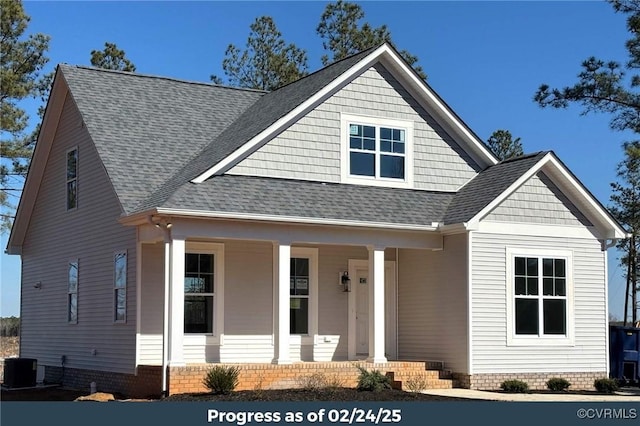 view of front of property with a porch, crawl space, a shingled roof, and cooling unit