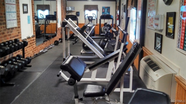 gym with brick wall