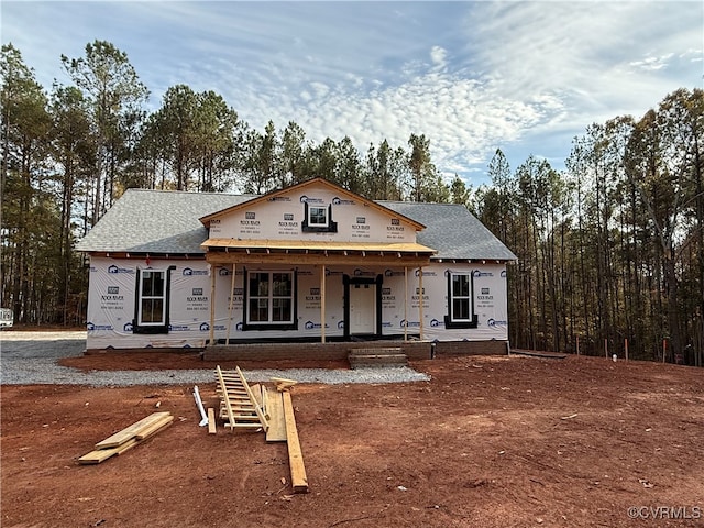 property under construction with covered porch