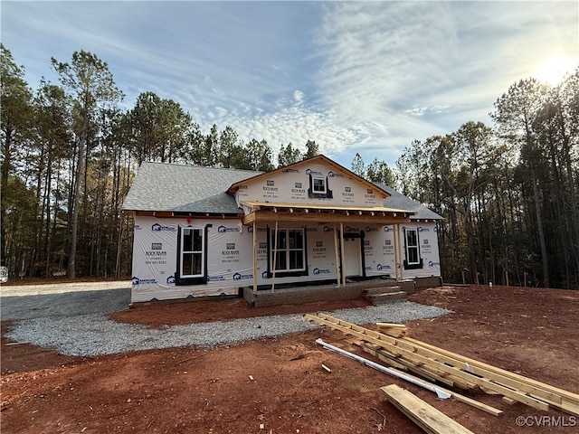 unfinished property featuring a porch