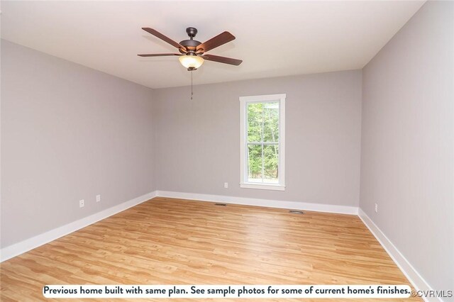 unfurnished room with hardwood / wood-style flooring and ceiling fan