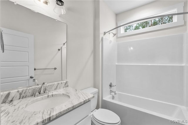 full bathroom with toilet, vanity, and bathtub / shower combination