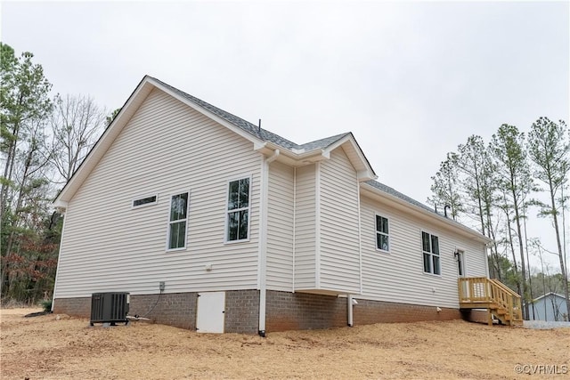 view of side of property with cooling unit