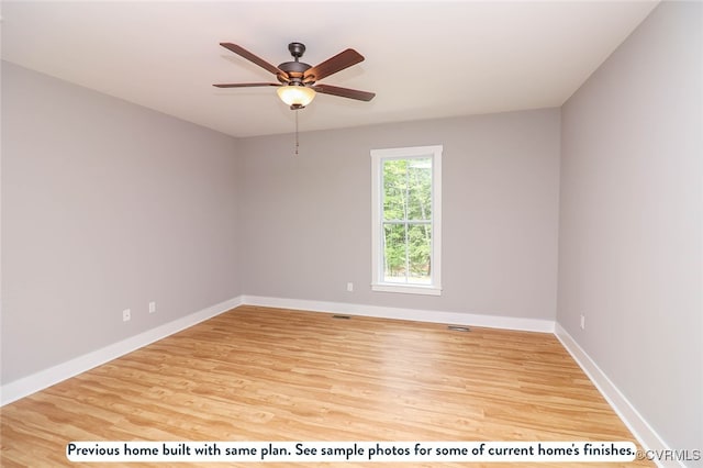 spare room featuring hardwood / wood-style floors and ceiling fan