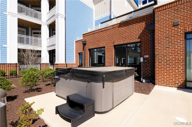 view of patio / terrace featuring a hot tub