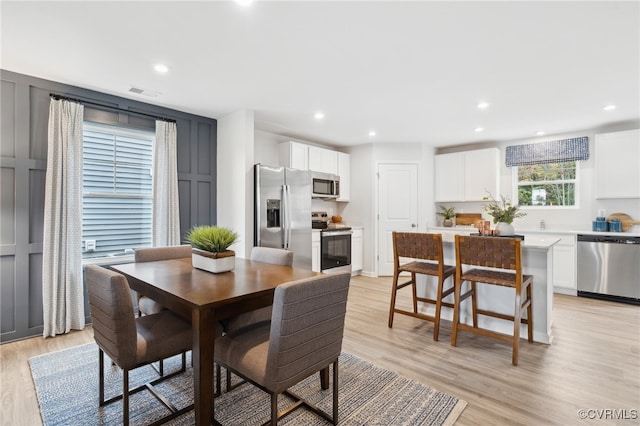 dining room with light hardwood / wood-style flooring