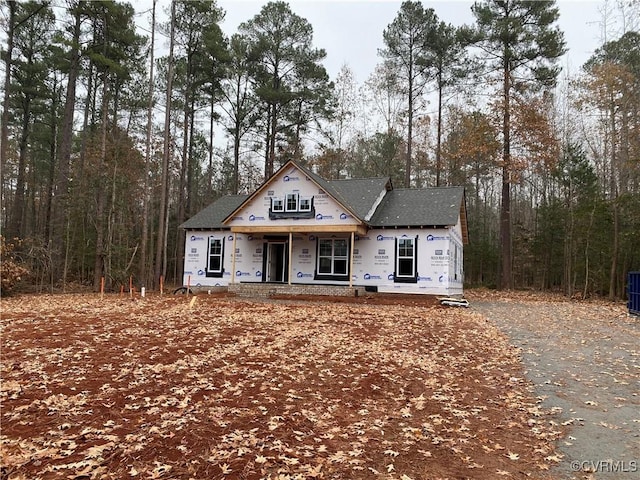 unfinished property featuring a porch