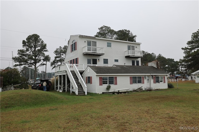 back of house featuring a lawn