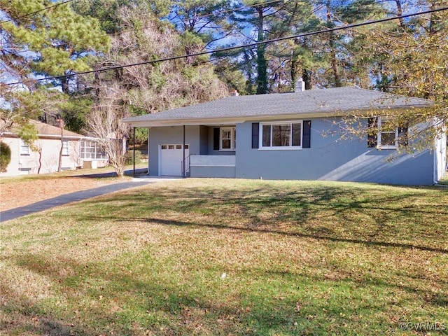 ranch-style house with a front yard and a garage