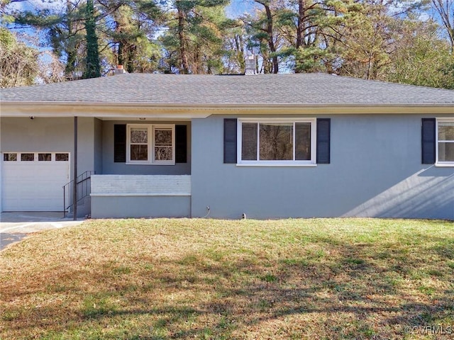 ranch-style home featuring a front lawn and a garage