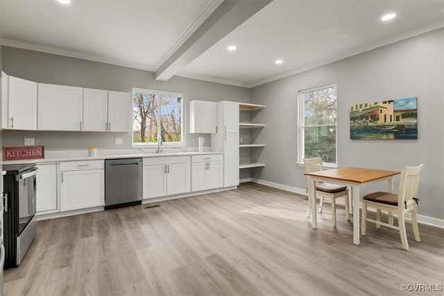 kitchen featuring white cabinets, appliances with stainless steel finishes, light hardwood / wood-style flooring, and crown molding