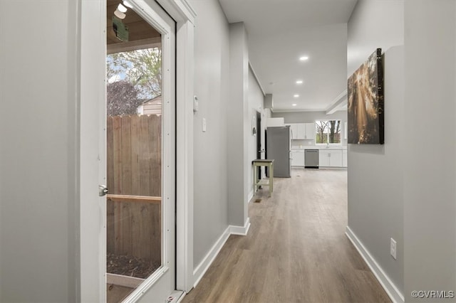 corridor featuring light hardwood / wood-style floors