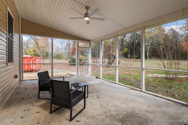 sunroom with a wealth of natural light, vaulted ceiling, and ceiling fan