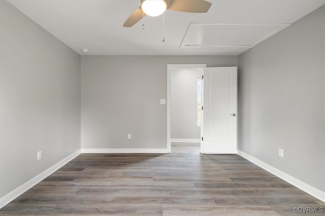 spare room featuring hardwood / wood-style flooring and ceiling fan