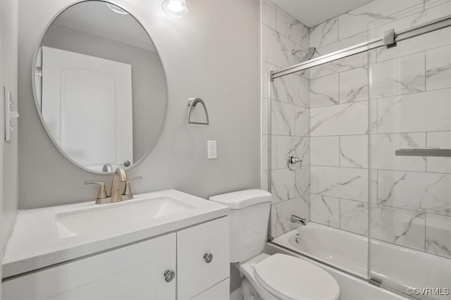 full bathroom with vanity, toilet, and shower / bath combination with glass door