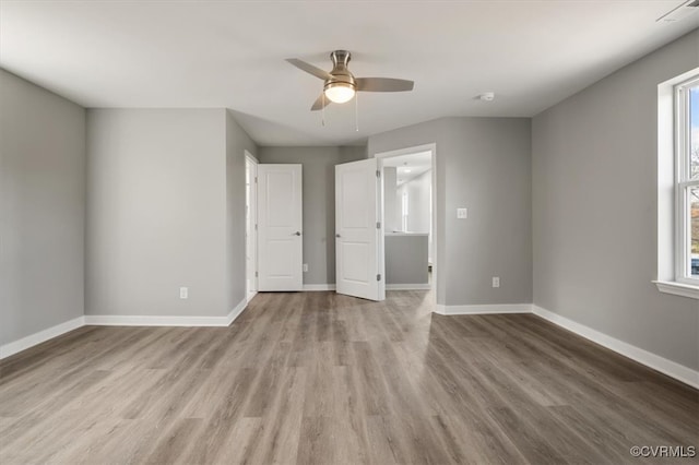 unfurnished bedroom with ceiling fan and light hardwood / wood-style flooring