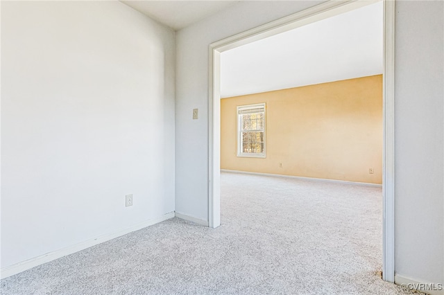 spare room with light carpet