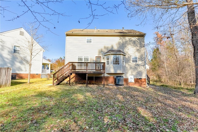 back of house with central AC, a yard, and a deck