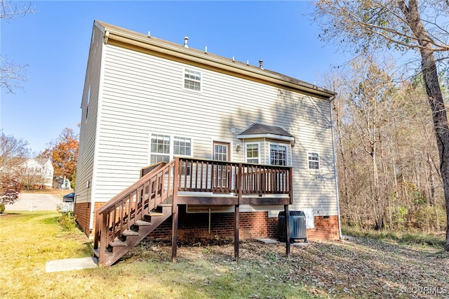 back of property featuring central AC, a yard, and a wooden deck