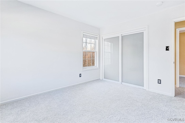 unfurnished bedroom featuring a closet and carpet floors