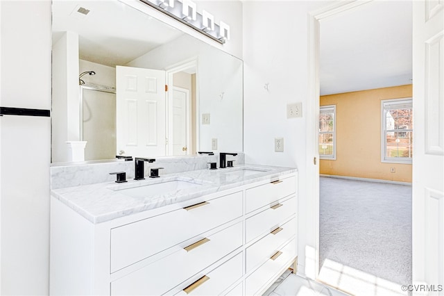 bathroom with a shower and vanity