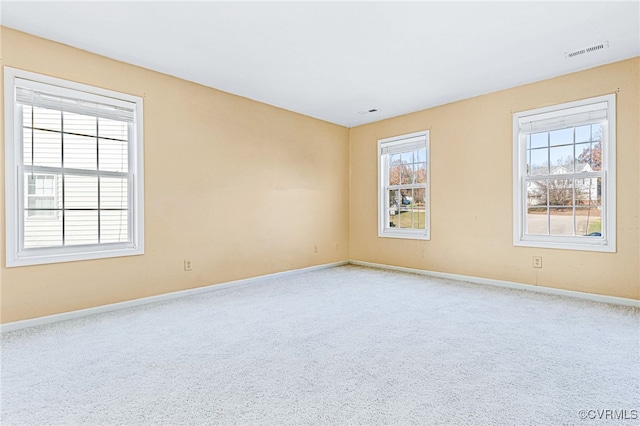 unfurnished room featuring carpet