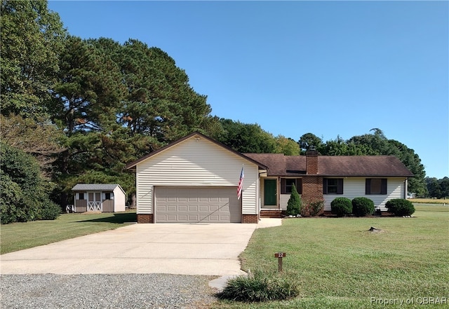 ranch-style home with a garage, an outbuilding, and a front yard