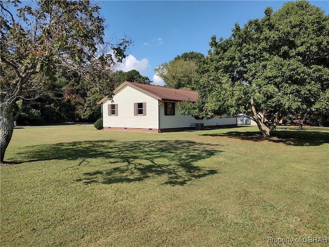 view of yard with central AC