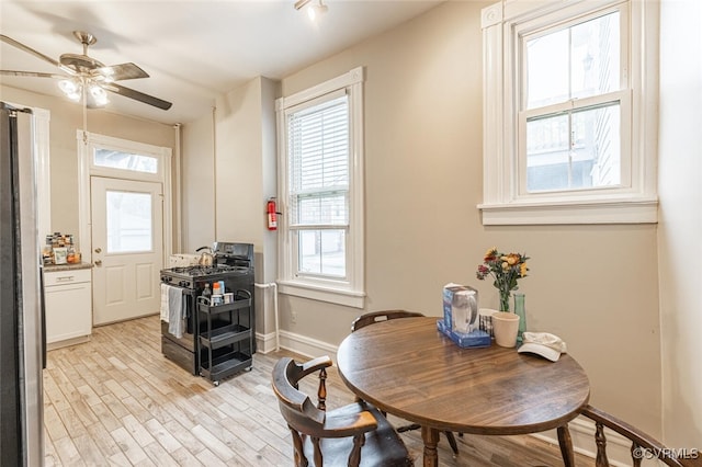 dining room featuring ceiling fan and light wood-type flooring