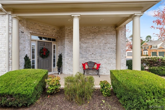 property entrance featuring a porch