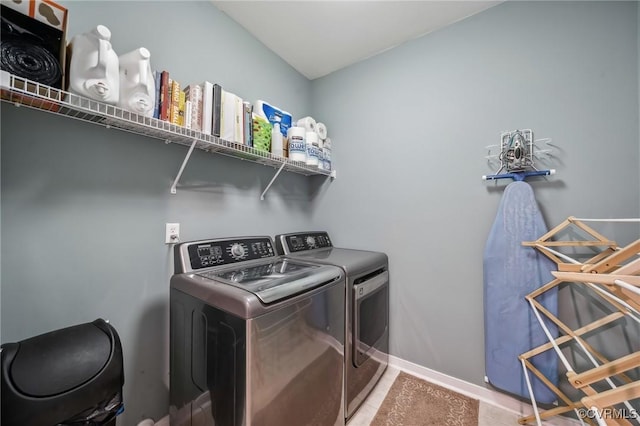 laundry area with separate washer and dryer