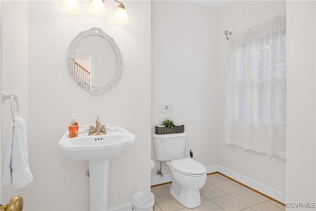 bathroom featuring toilet and tile patterned floors