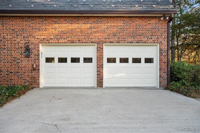 garage featuring driveway