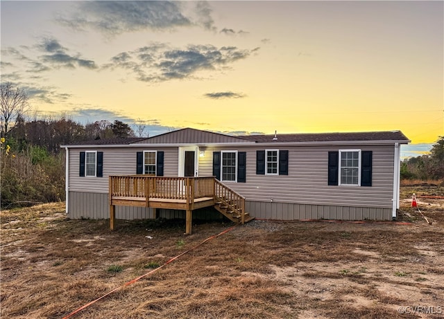 manufactured / mobile home featuring a wooden deck