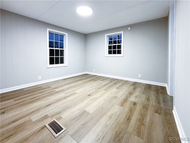 unfurnished room featuring light wood-type flooring