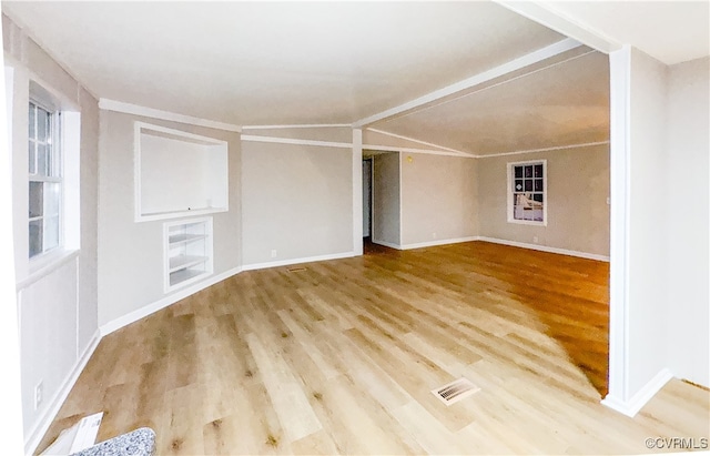 spare room with hardwood / wood-style flooring and ornamental molding