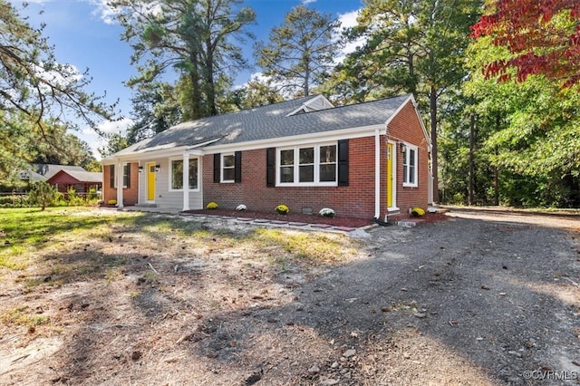 ranch-style house featuring a porch