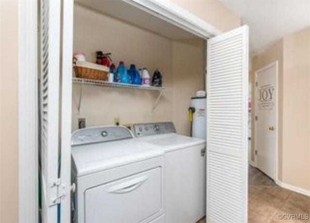 laundry room with light tile patterned floors and independent washer and dryer