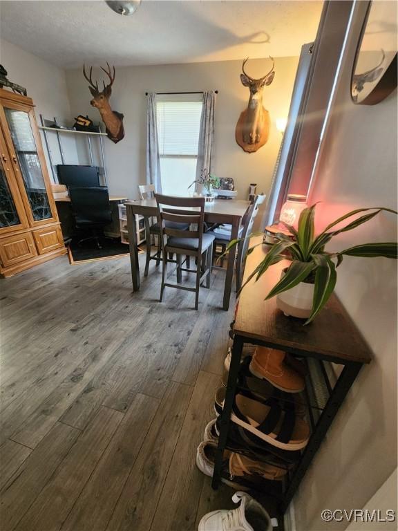 dining room with dark hardwood / wood-style flooring