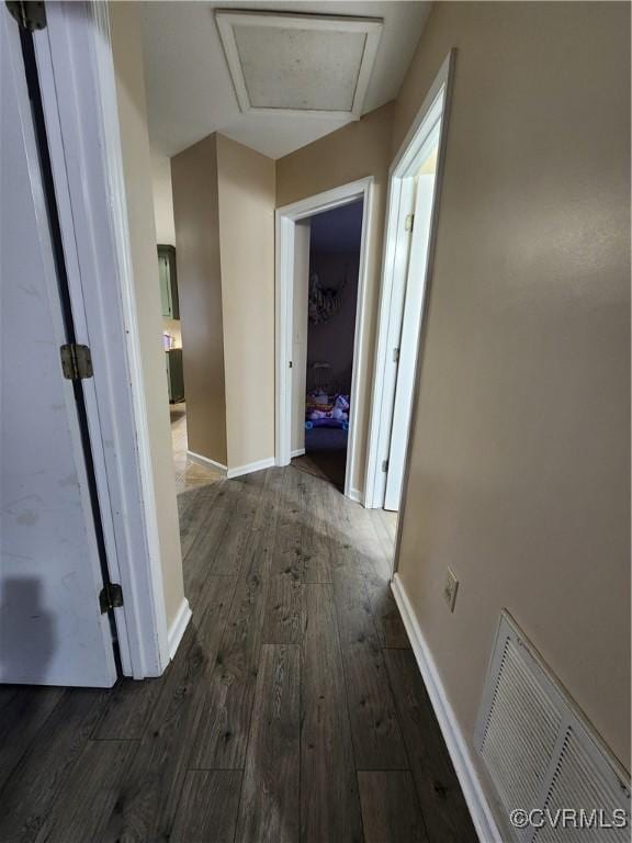 hall with dark hardwood / wood-style floors