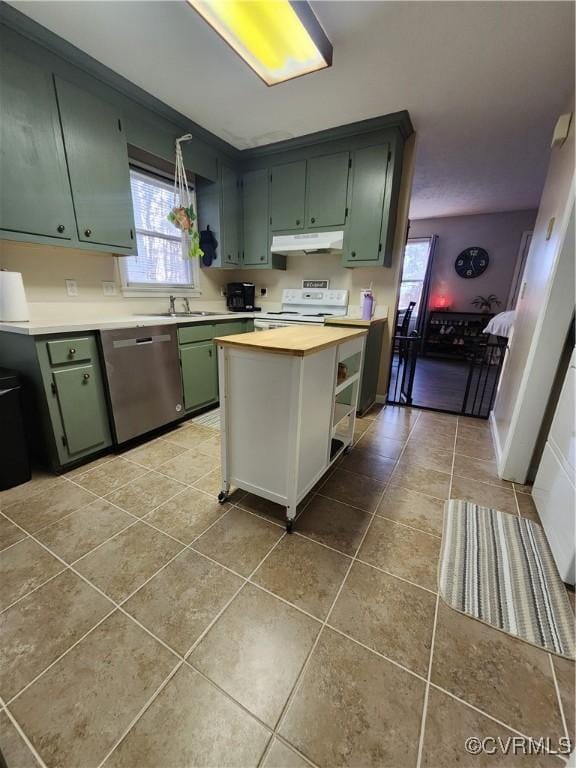 kitchen featuring tile patterned flooring, dishwasher, and electric range