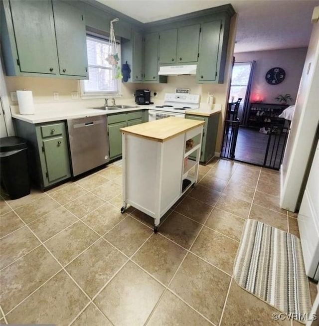 kitchen featuring sink, dishwasher, white electric range, and light tile patterned flooring