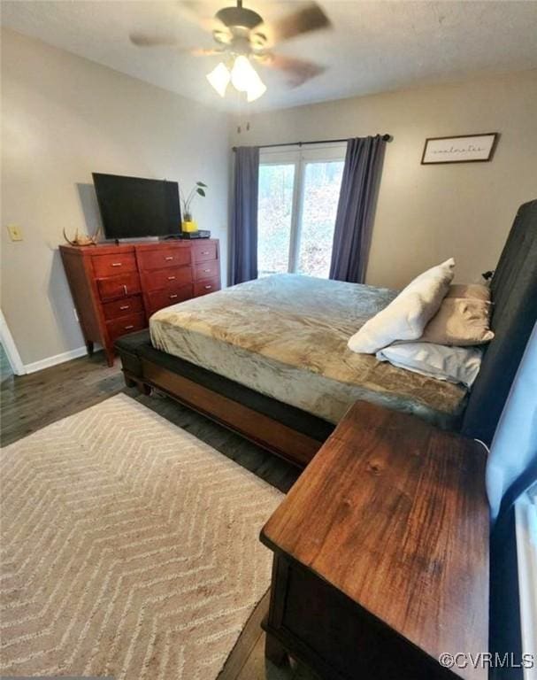 bedroom featuring ceiling fan and hardwood / wood-style flooring