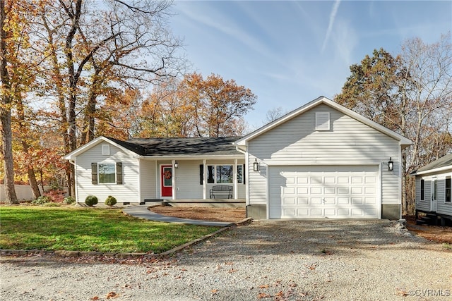 ranch-style home with covered porch, a garage, and a front lawn