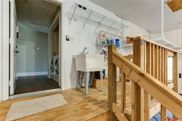 laundry room with attic access, laundry area, and independent washer and dryer