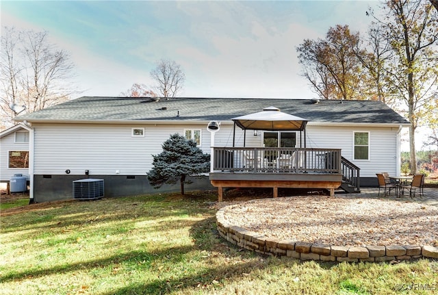 rear view of house featuring central AC unit, a gazebo, a lawn, crawl space, and a wooden deck